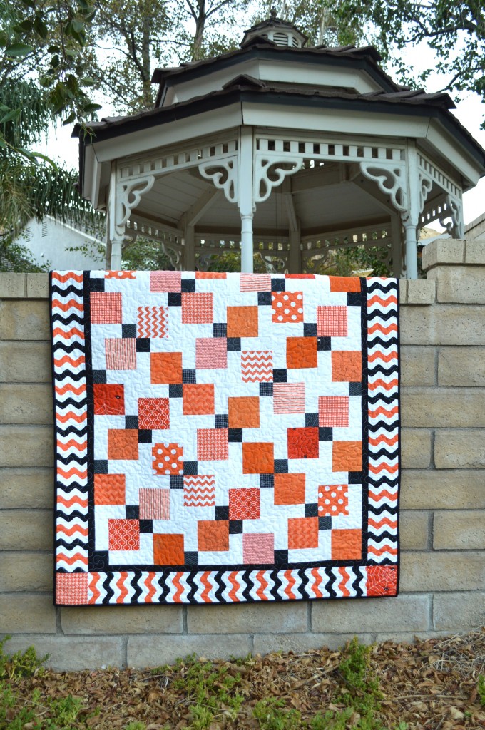 "Halloween Disappearing 9-Patch Quilt" is a Free Halloween Quilt Pattern designed by Amanda from Jedi Craft Girl!